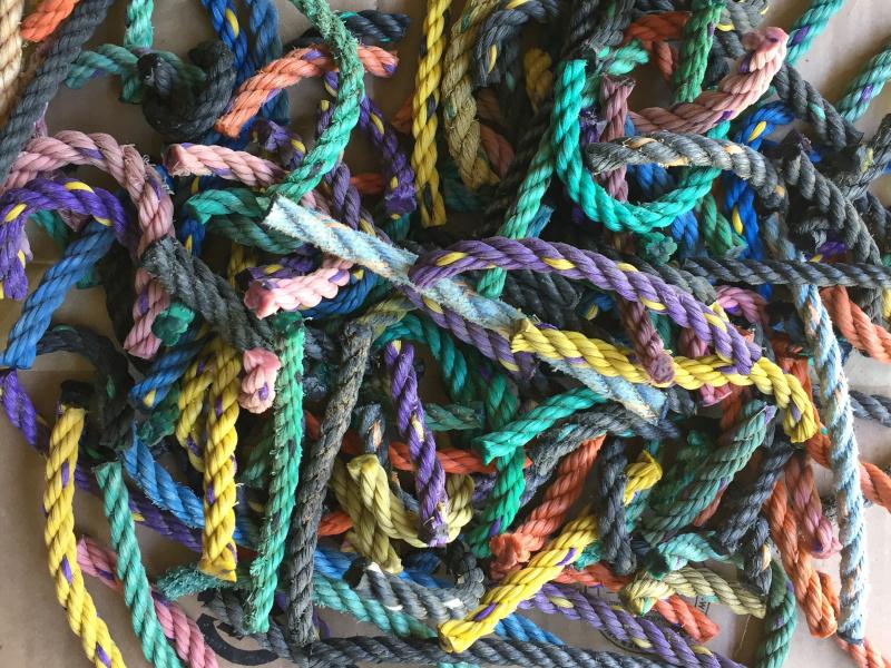 Eco-friendly welcome mats and wreaths made with short pieces of upcycled rope that would otherwise be waste.
